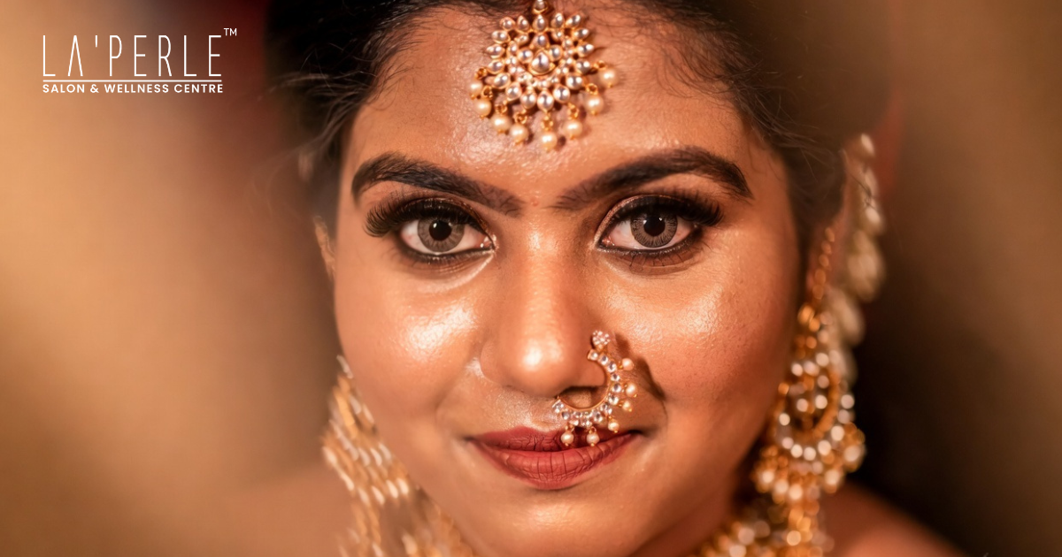 Elegant South Indian bridal makeup with gold jewelry and saree